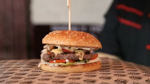 Ready delicious hamburger with beef kettle, cheese, make-up, onion Stock Footage 91269614