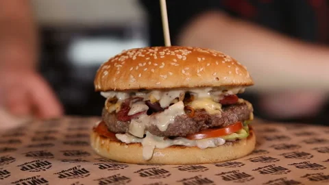 Ready delicious hamburger with beef kettle, cheese, make-up, onion Stock Footage 91519177