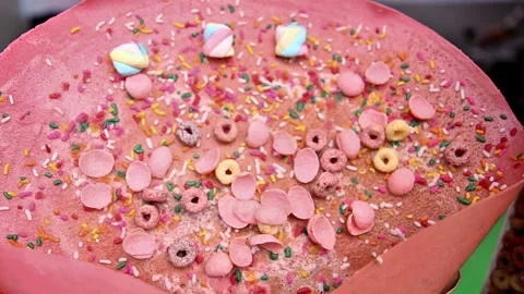 Ready-to-eat d'crepes with added sugary chocolate and yuppy candy Video stock 273040887