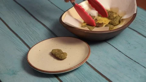 Ready to eat fried fish serving on plate in 4k side angle Video stock 166091576