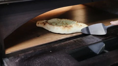 Ready to eat khachapuri already cooked in oven. A national Georgian dish - Stock Footage 134208587