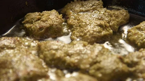 Ready to eat marinated fish in boiling oil 4k top angle Video stock 166092340