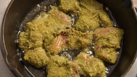 Ready to eat marinated fish in boiling oil 4k top angle Video stock 166092628
