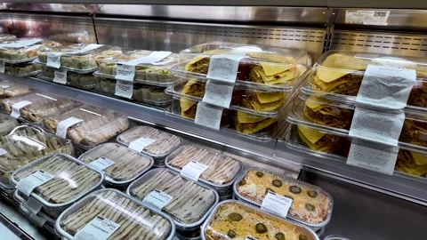 Ready to eat meal solutions, including tacos and burritos, displayed in a Stock Footage 327714613