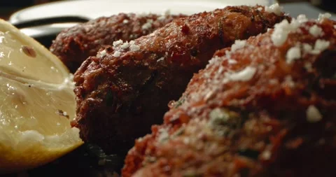 Ready fried cheese in halloumi with lemon. Serving a delicious dish on a plate. Video stock 307070185