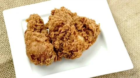 Ready-fried delicious hot chicken on plate Stock Footage 83649857