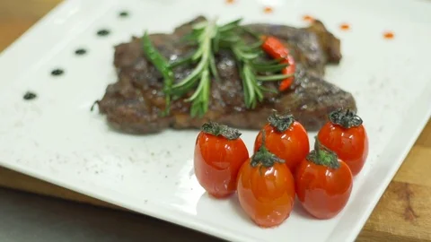 Ready fried steak, the cook prepares the dish Stock Footage 74306472