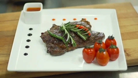 Ready fried steak, the cook prepares the dish Stock Footage 74306531