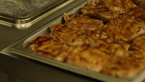 Ready, fried steaks in the restaurant's professional kitchen Stock Footage 232562608