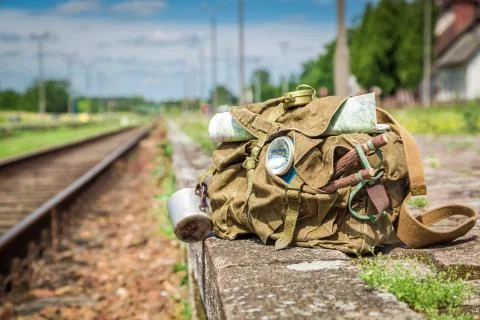 Ready to go backpack with map on railway station Stock Photos