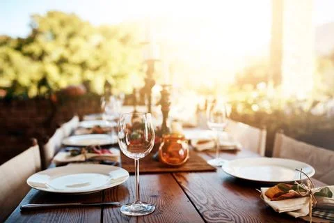 Ready for the guests. a the layout of a Thanksgiving dining table outside. Stock Photos