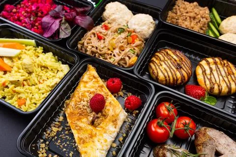 Ready healthy food catering menu in lunch boxes meat and vegetable packages a Stock Photos