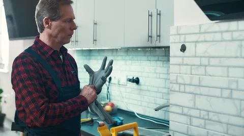 Ready to help. Man solves small household problems 写真素材