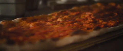 Ready hot from the oven base for traditional italian al taglio pizza. Close u Stock Footage 146601844