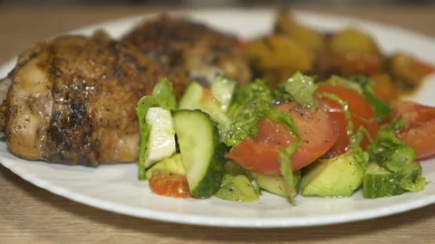Ready lunch of potatoes, baked chicken and salad. Slider shot Stock Footage 169744338