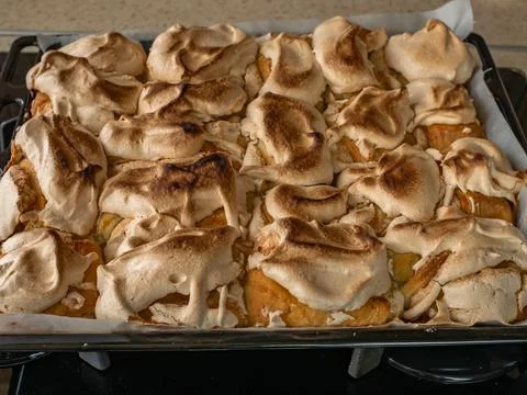 Ready-made cakes on a hot iron pan. Close-up of the finished cookie. Home Stock Photos