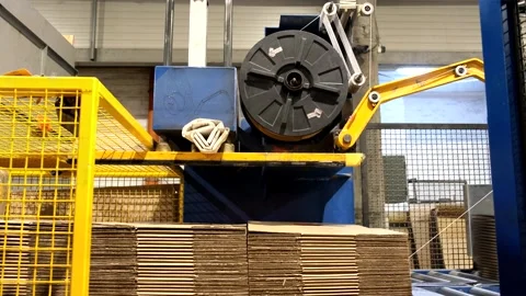 Ready-made cardboard boxes are moved in stacks along an automated packaging.. Stock Footage 256596734