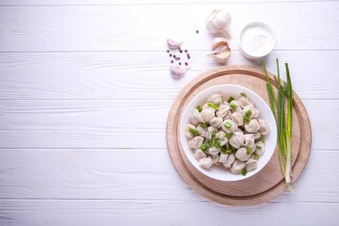 Ready-made dumplings on a white background with place for text Stock Photos