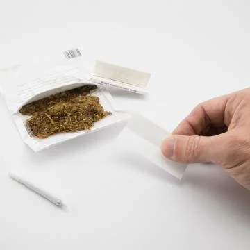 Ready to make another cigarette Stock Photos