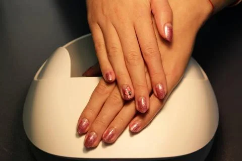 Ready manicure shellac. color shellac pink gold. ready manicure shellac. c... Stock-Fotos