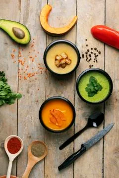 Ready meal in plastic boxes, pea and pumpkin soups. Vertical Stock Photos