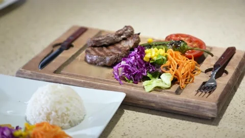 Ready meat dish with a garnish on a table Stock Footage 161072344
