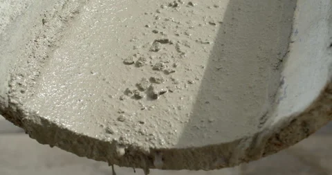 Ready-mixed cement flows down from the cement truck. Stock Footage 281237092