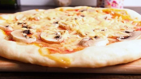 Ready pizza close-up on the Board, on the table. Stock Footage 114751566