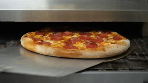 Ready pizza comes from the oven Video stock 153965425