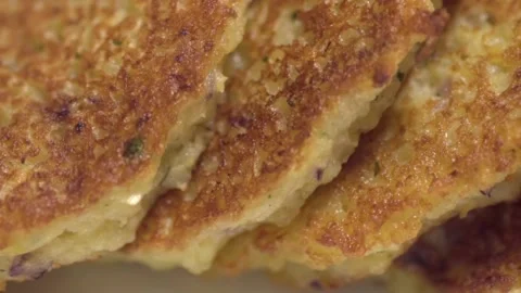 Ready potato pancakes are on the plate. Close-up. Stock Footage 146572425