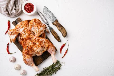 Ready to roast raw Chicken Tabaka, on white stone table background, top view  Stock Photos
