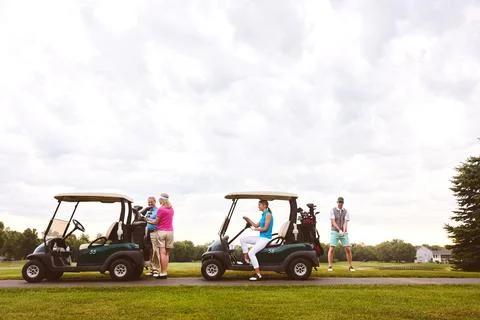 Ready for some golf. two couples with golf carts spending a day on the golf Fotos Stock
