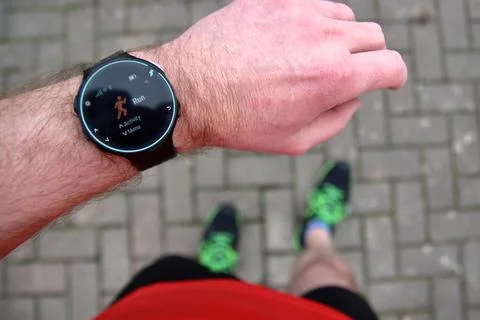 Ready to start running with watch Stock Photos