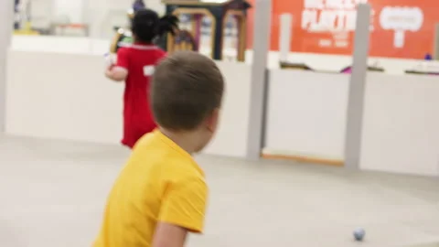 Ready steady go. Boy run up wall in playroom. Stock Footage 264800260