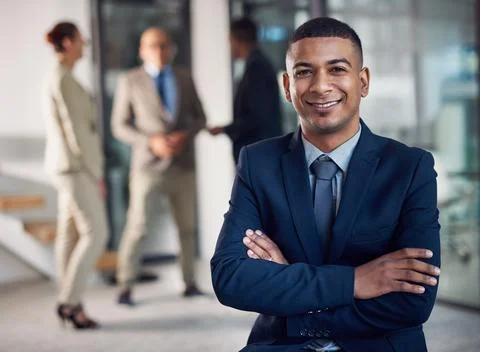 Ready for success. Portrait of a corporate businessman standing in an office. Stock Photos