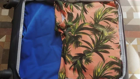 Ready for summer holidays prepare suitcase throw clothes in suitcase. Travel. Stock Footage 281790116