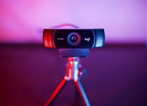 Ready to use Logitech webcam with tripod on desk. Stock Photos