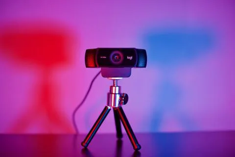 Ready to use Logitech webcam with tripod on desk. Stock Photos