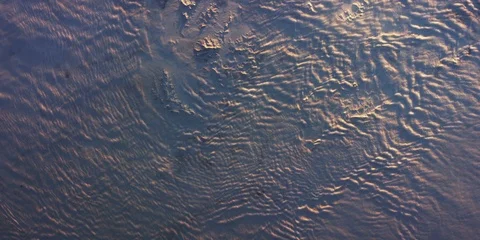 Real 4K footage of dense sunset storm clouds from space Stock Footage 105916713