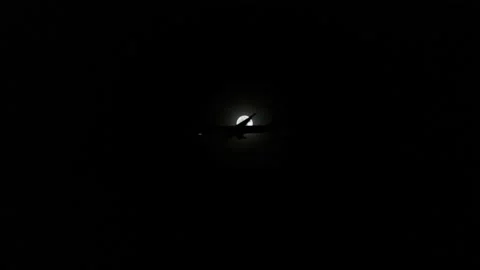 Real Airplane through the full moon Stock Footage 236496055
