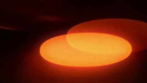 Real anamorphic orange bokeh light beam winking on black background. Stock Footage 234405266