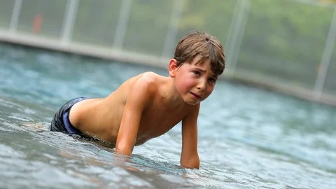 Real authentic crying kid trying to get up after being hurt by brother. Child Stock Footage 88985148