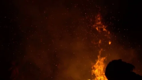 Real big bonfire on nature wit people silhouette Stock Footage