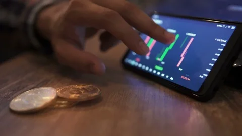 Real bitcoin coins on table. Block-chain, trading online, Cryptocurrency trend Stock Footage 117064432