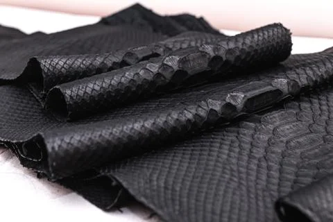 Real black snakeskin python leather. Stock Photos