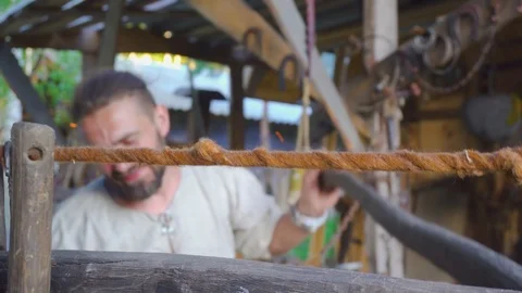 Real blacksmith working with blacksmith furs in forge. Stock Footage 108826009