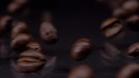 Real coffee. Super slow motion shot of premium fresh roasted brown coffee beans Video stock 147411908