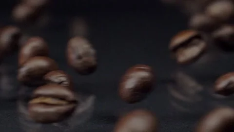 Real coffee. Super slow motion shot of premium fresh roasted brown coffee beans Video stock 150559943