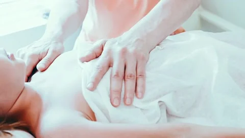 Real doctor osteopath hands does physiological and emotional therapy for kid Stock Footage 158287349