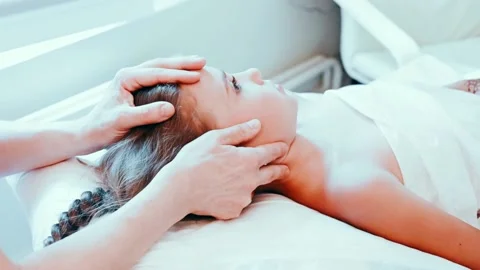 Real doctor osteopath hands does physiological and emotional therapy for kid Stock Footage 158287420